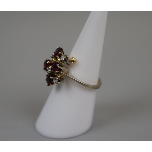 61 - 18ct gold ruby & diamond set ring - Size: L