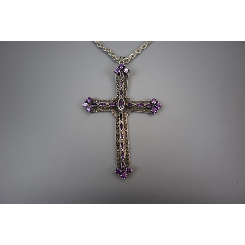 71 - Amethyst set silver crucifix on silver chain together with 2 silver rings