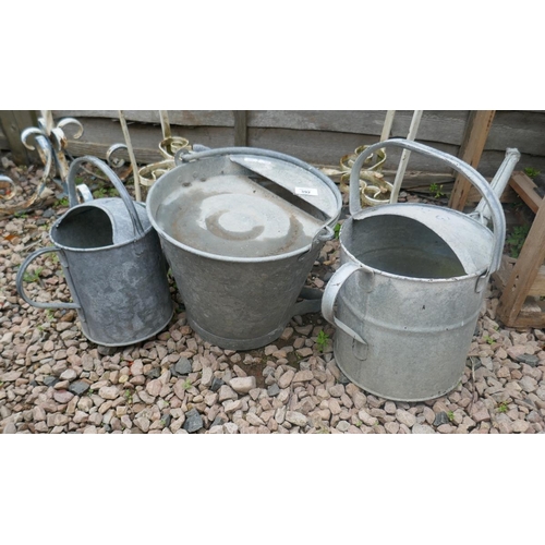 392 - 2 galvanised watering cans together with galvanised poultry drinking bucket