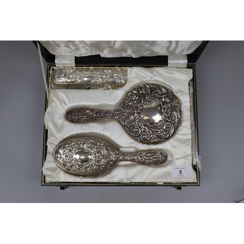 5 - Hallmarked silver cased dressing table set