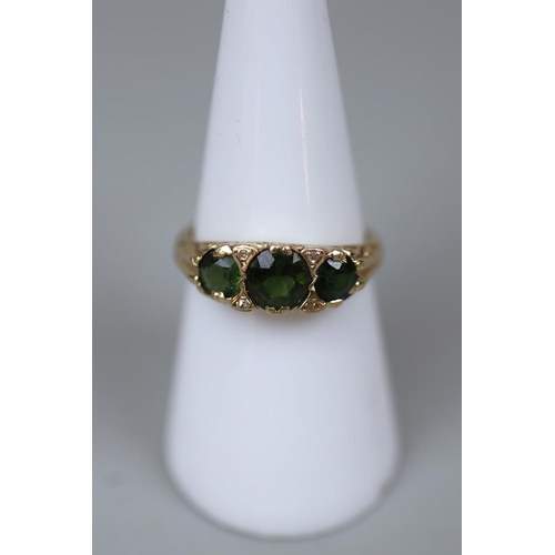 57 - Gold green garnet set ring - Size N