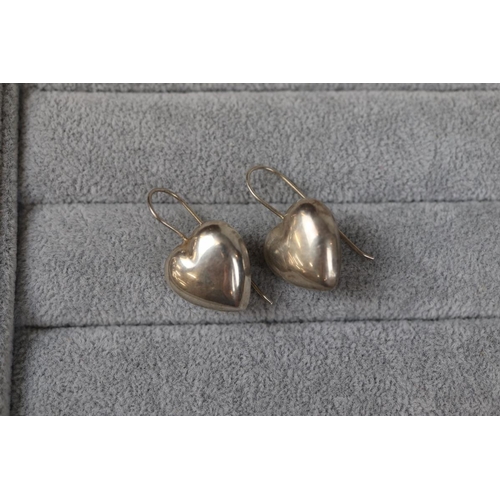 34 - Pair of silver heart shaped earrings