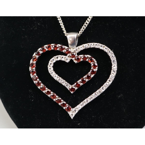 62 - Large silver garnet heart shaped pendant