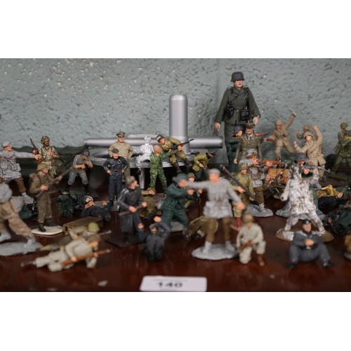 140 - Collection of military figurines etc.