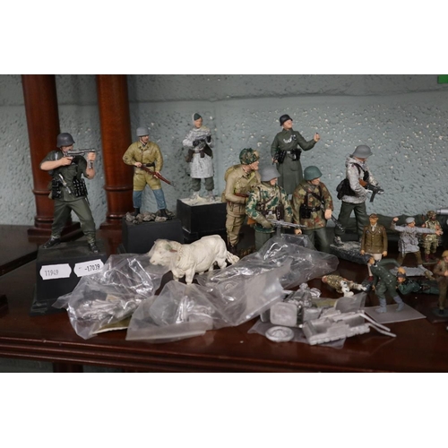 140 - Collection of military figurines etc.