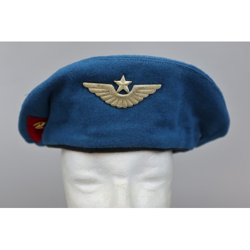 143 - Russian Paratroopers beret with badges together with an Italian Paratroopers beret with badges