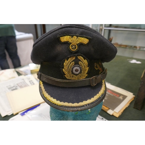 157 - Genuine U-boat Commander's cap with running devil insignia
