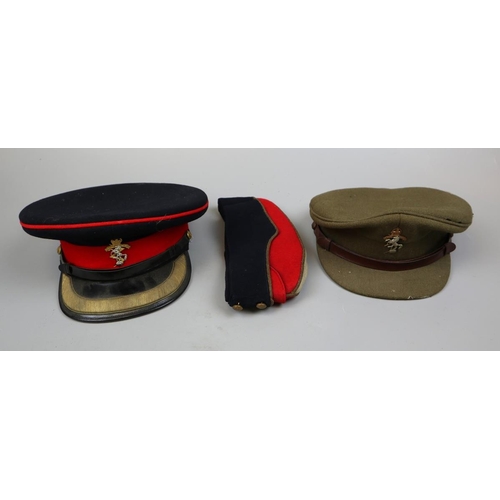 217 - 2 uniforms together with a tin trunk belonging to Major J.W Pogmore which includes 2 citations signe... 