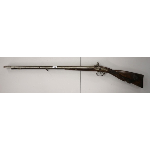 228 - Double barrel flint lock rifle with carved stock