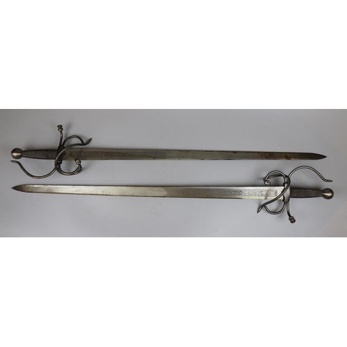 240 - Pair of Coladadelcid toledo basket handle swords