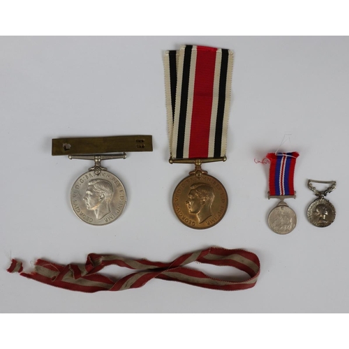 253 - Collection of medals to include a for faithful service in the special constabulary marked Earnest R ... 