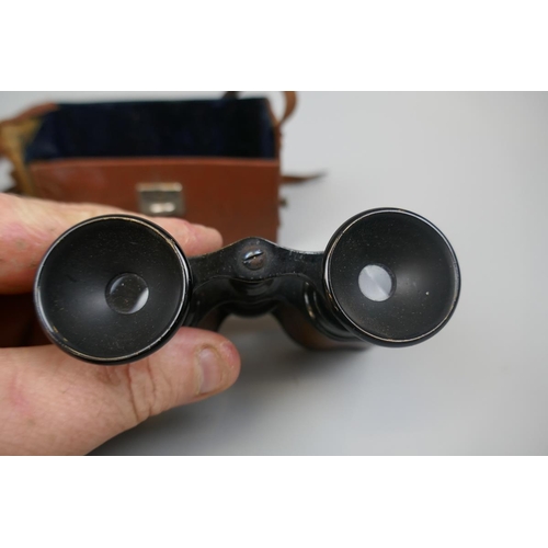 308 - Pair of field glasses in original case together with another marked Chevalier Paris