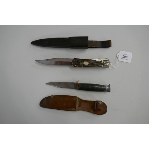 387 - German folding bowie knife in sheath together with a fighting knife in sheath marked William Rogers ... 