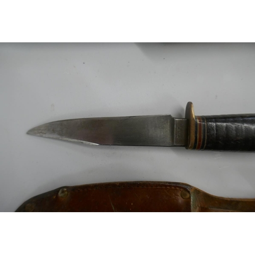 387 - German folding bowie knife in sheath together with a fighting knife in sheath marked William Rogers ... 