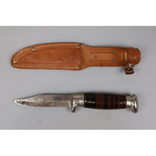 78 - Knife in sheath marked Richards Tent Brand