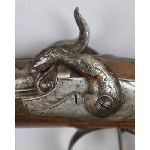 228 - Double barrel flint lock rifle with carved stock