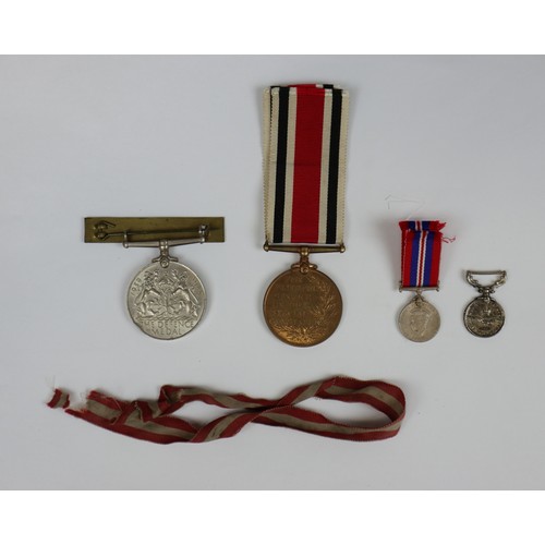 253 - Collection of medals to include a for faithful service in the special constabulary marked Earnest R ... 