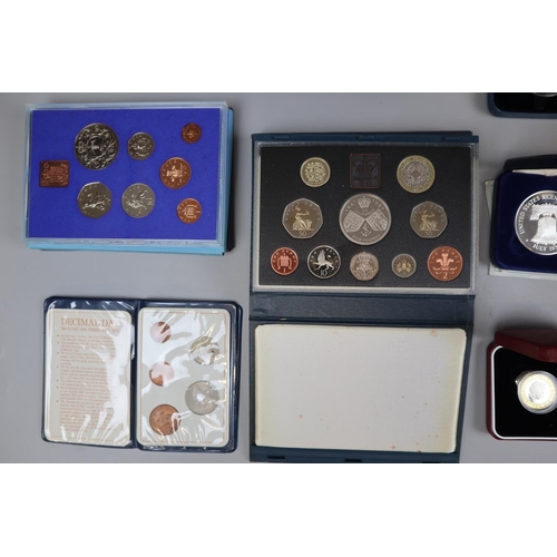 114 - Collection of commemorative coins in original boxes