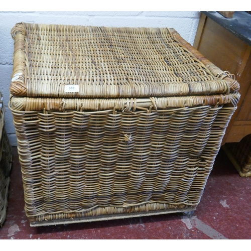 389 - Large wicker basket on casters