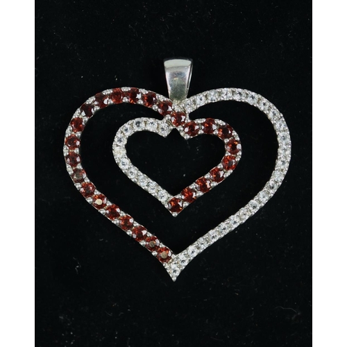 73 - Large silver heart shaped garnet pendant