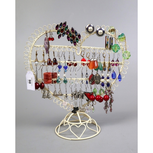 98 - Approx 33 pairs of costume earrings together with stand