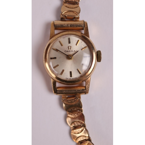 103 - Ladies Omega 17 jewel watch with a 9ct gold case & a rolled gold strap