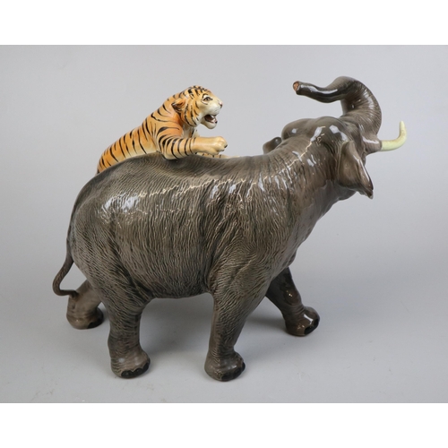 196 - Large Beswick elephant & tiger - Approx height 30cm A/F  (tusks have been reattached it does dis... 