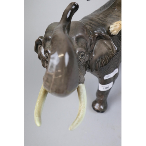 196 - Large Beswick elephant & tiger - Approx height 30cm A/F  (tusks have been reattached it does dis... 