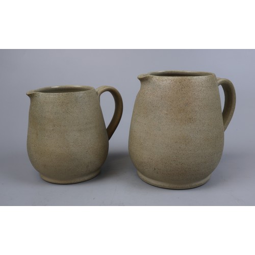 225 - 2 graduated pottery jugs