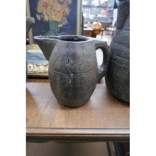 440 - 3 antique graduated wooden jugs