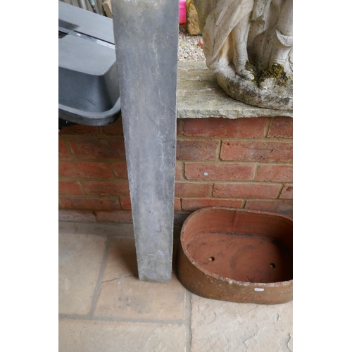556 - Lead pipe together with terracotta planter