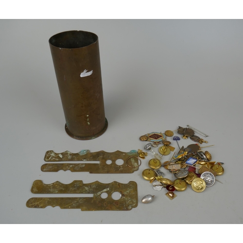 103 - Collection of military badges and buttons together with brass shell and button cleaning guard