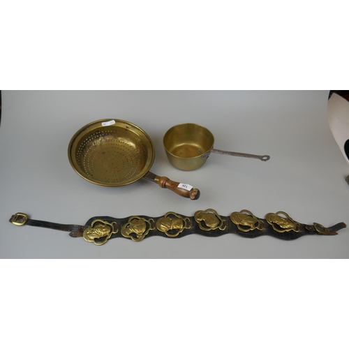 126 - Collection of brass to include colander and horse brasses featuring Dickens characters