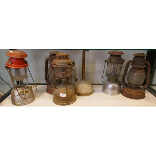 127 - Collection of paraffin lamps to include Tilley lamp