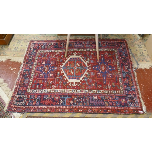 307 - Small red patterned rug - Approx size: 104cm x 136cm