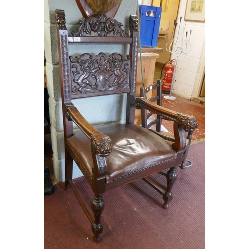 310 - Antique carved armchair adorned with lions