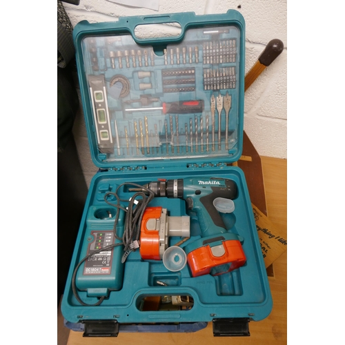 335 - Makita drill in case with accessories