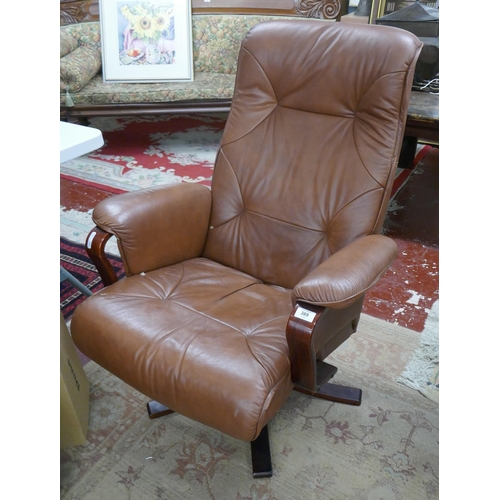 389 - Brown leather swivel easy chair