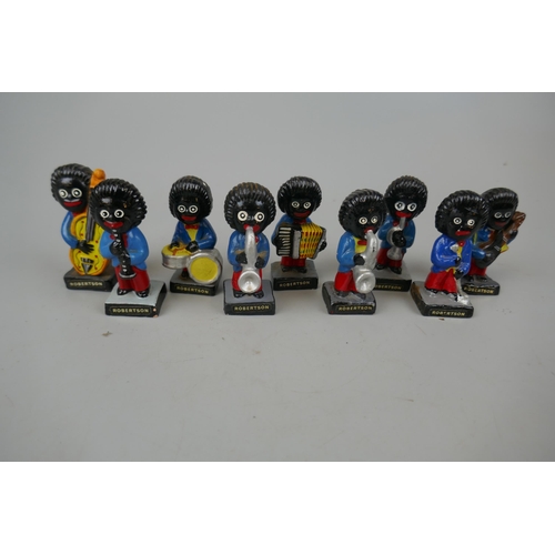 65 - Collection of 9 Robertson Golly figurines.These items are listed on the basis they are illustrative ... 