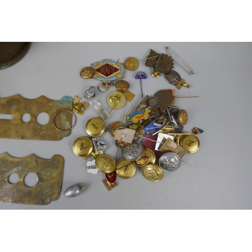 103 - Collection of military badges and buttons together with brass shell and button cleaning guard