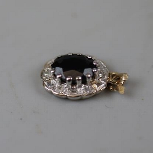 17 - 9ct gold sapphire and diamond pendant