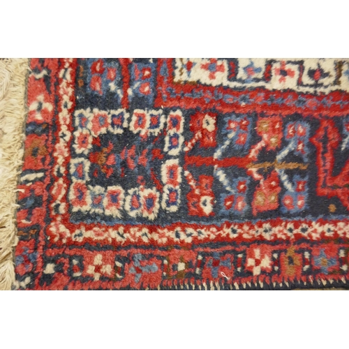 307 - Small red patterned rug - Approx size: 104cm x 136cm