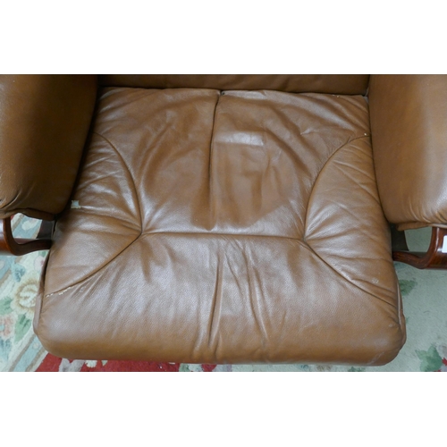 389 - Brown leather swivel easy chair