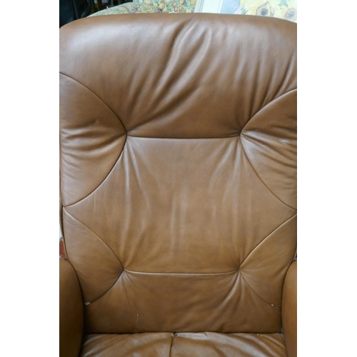 389 - Brown leather swivel easy chair