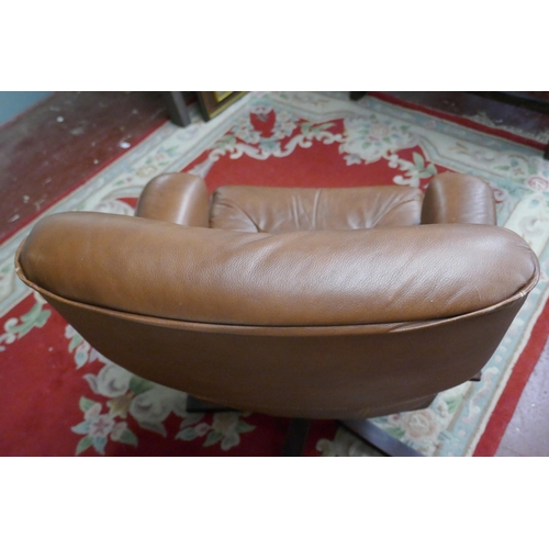 389 - Brown leather swivel easy chair