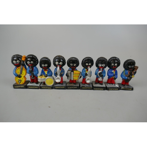 65 - Collection of 9 Robertson Golly figurines.These items are listed on the basis they are illustrative ... 
