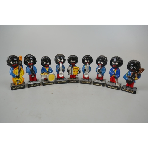 65 - Collection of 9 Robertson Golly figurines.These items are listed on the basis they are illustrative ... 