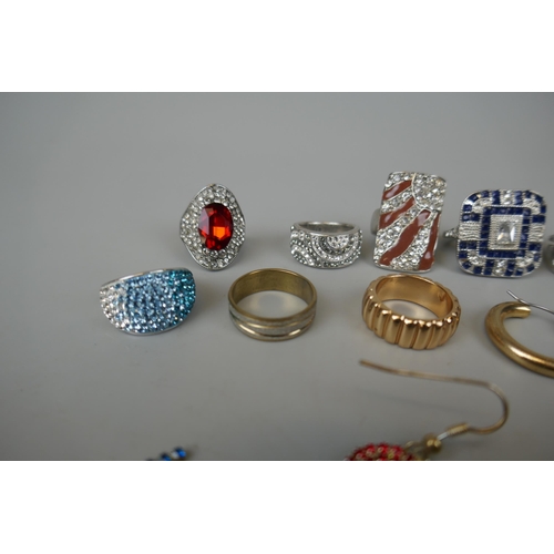 67 - 10 costume rings together with 3 pairs of earrings