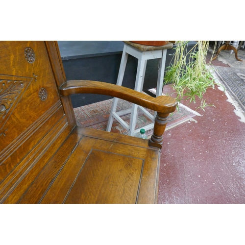 394 - Carved oak bench with integrated storage - Approx size: W: 135cm D: 49cm H: 102cm