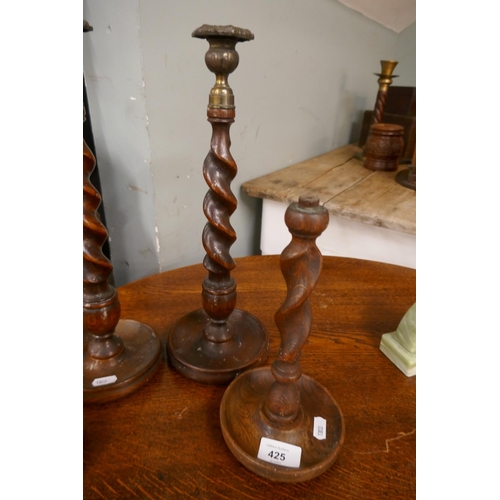 425 - 2 pairs of oak barley-twist candlesticks